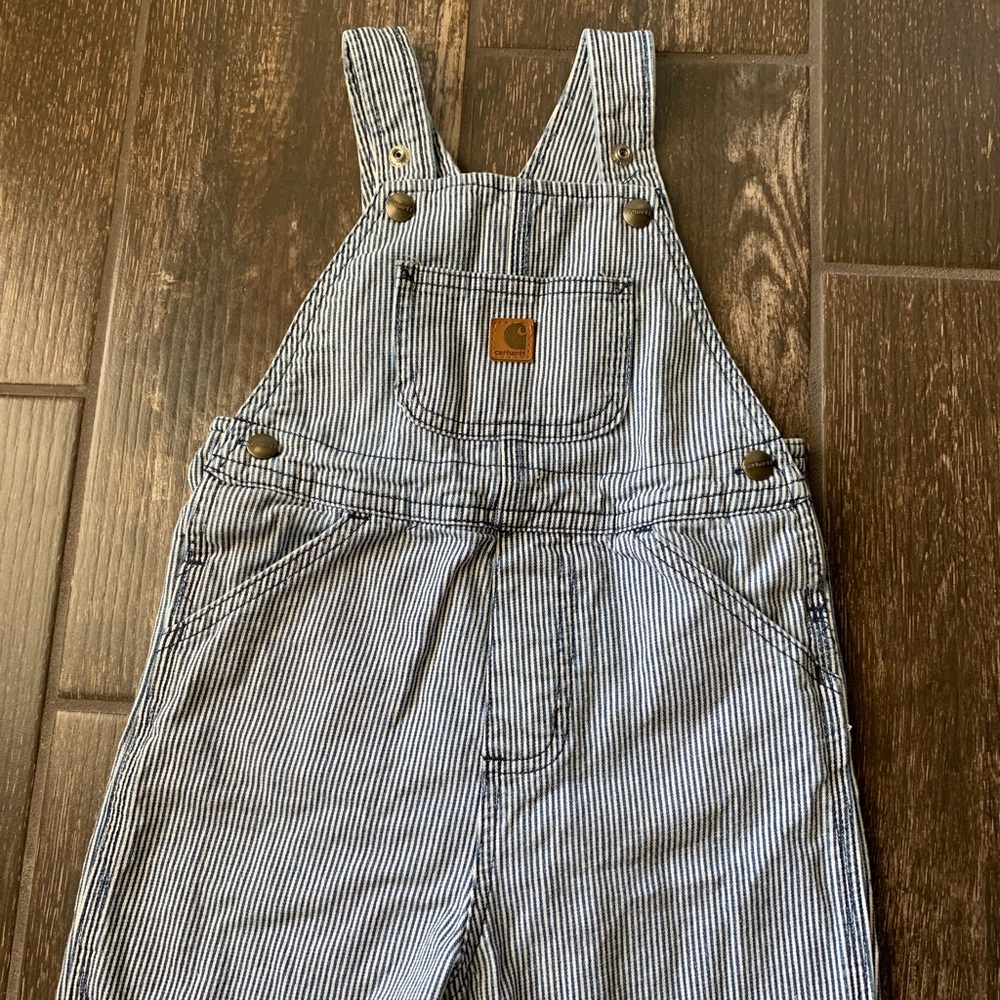 Blue and white pinstriped overall shorts